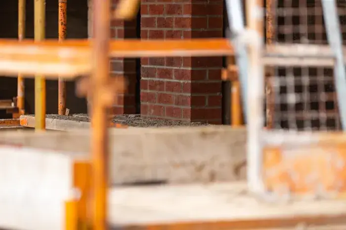 Brickwork behind blurred scaffolding