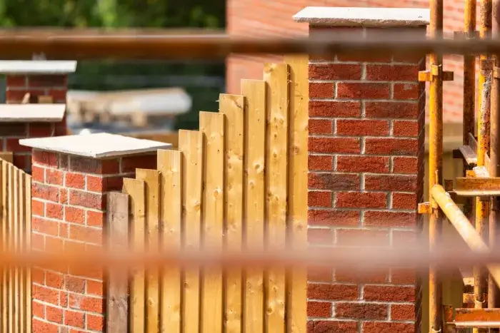 Brick pillars with fence between