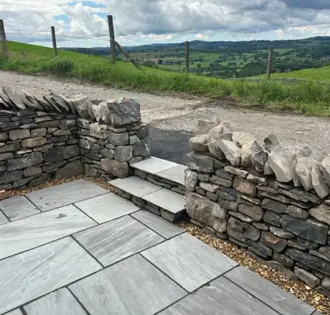 Traditional dry-stone walling with modern paving